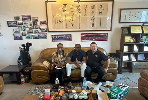 Ugandan customer Mr.Mark and his sister visits for inspection of automatic paper lid die cutting machine